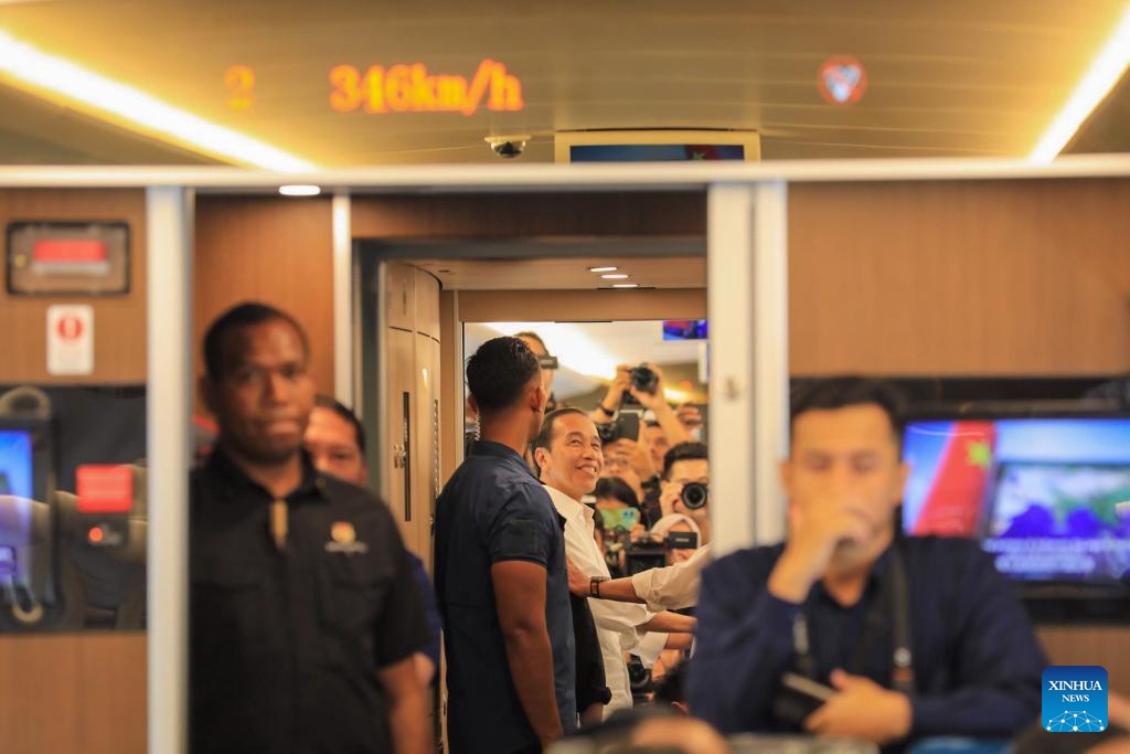 Indonesian President Joko Widodo (C) talks with passengers on a running high-speed electric multiple unit (EMU) train for the Jakarta-Bandung High-Speed Railway in Indonesia, Sept. 13, 2023. Indonesian President Joko Widodo took a ride Wednesday on the Jakarta-Bandung High-Speed Railway (HSR), a landmark project under the China-proposed Belt and Road Initiative.(Photo: Xinhua)