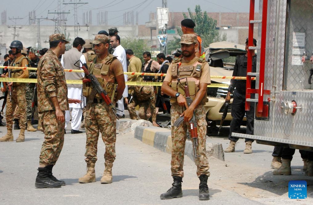 Security personnel stand guard near the explosion site in northwest Pakistan's Peshawar on Sept. 11, 2023. Seven security members and four civilians were injured when a bomb went off in Pakistan's northwest Khyber Pakhtunkhwa province on Monday, rescue teams and police said.(Photo: Xinhua)