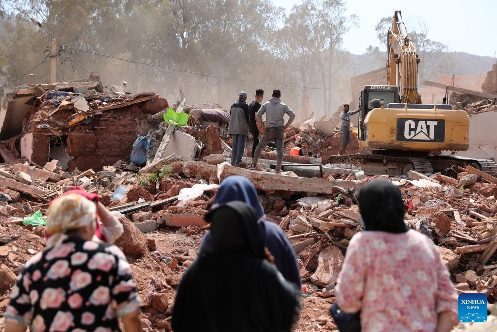 An excavator clears earthquake debris in Al Haouz Province, Morocco, Sept. 12, 2023. The death toll from the devastating earthquake in Morocco has risen to 2,901, and the injuries to 5,530, according to the latest statement released by the Moroccan government on Tuesday.(Photo: Xinhua)