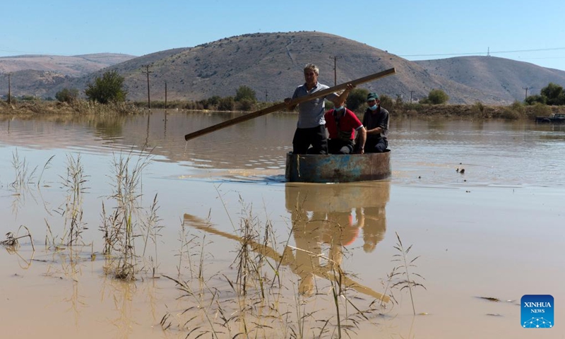 A boatman tranfers passengers through a flooded area in the village of Metamorfosi, Karditsa, Greece, on Sept. 12, 2023. Regions in central Greece are on alert for the impact of the recent floods on public health, local officials said on Tuesday. Fifteen people died and 4,570 were evacuated to safety during the floods, according to the Fire Brigade.(Photo: Xinhua)