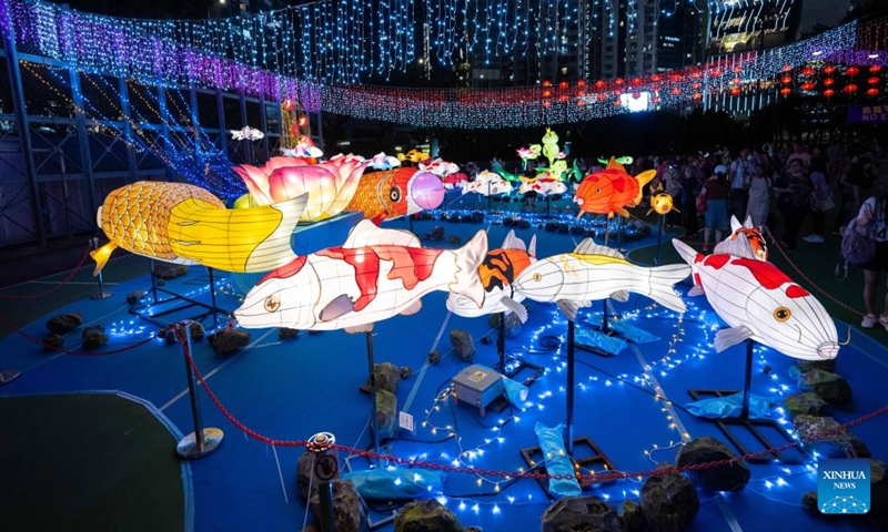 People visit a Mid-Autumn lantern fair at Victoria Park in Hong Kong, south China, Sept. 23, 2023. (Xinhua/Zhu Wei)