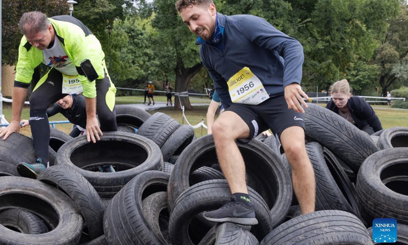 Participants compete in an obstacle course running competition in City Park Budapest, Hungary, on Sept. 24, 2023. (Photo by Attila Volgyi/Xinhua)