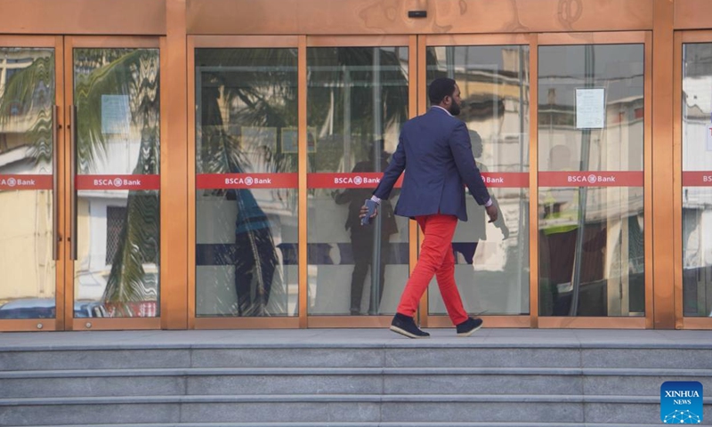 A client enters the headquarters of the Sino-Congolese Bank for Africa (BSCA) in Brazzaville, capital of the Republic of the Congo, Sept. 21, 2023. (Xinhua/Shi Yu)