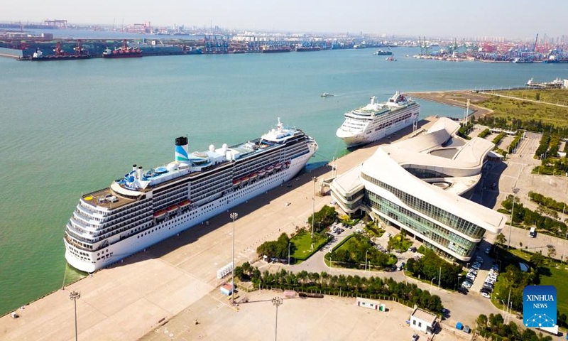 This aerial photo taken on Sept. 22, 2023 shows the cruise ships Mediterranea and Dream docked at a port in north China's Tianjin Municipality. (Xinhua)