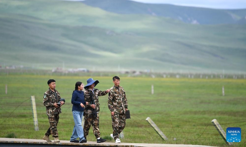 Staff members patrol the Gahai-Zecha National Nature Reserve in Gannan Tibetan Autonomous Prefecture, northwest China's Gansu Province, on July 7, 2023.（Photo: Xinhua)