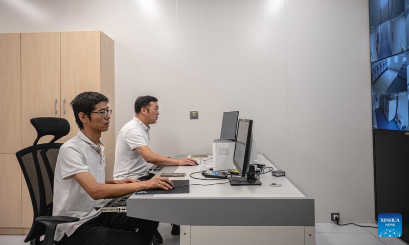 Staff members of the Chinese technical service team work at the headquarters of the Africa Centers for Disease Control and Prevention (Africa CDC) in Addis Ababa, Ethiopia, Sept. 11, 2023. Located in the southern suburbs of Addis Ababa, the China-aided headquarters of the Africa CDC was officially inaugurated in January 2023.(Photo: Xinhua)