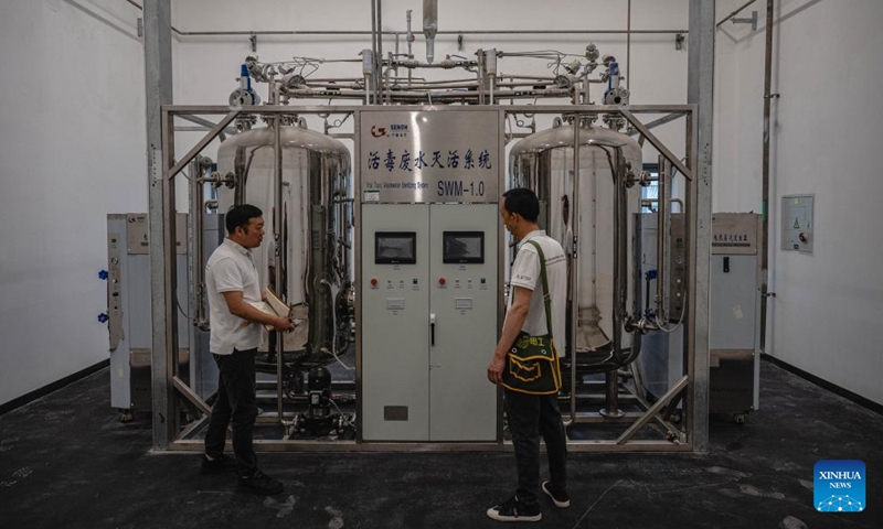 Staff members of the Chinese technical service team examine facilities at the headquarters of the Africa Centers for Disease Control and Prevention (Africa CDC) in Addis Ababa, Ethiopia, Sept. 11, 2023. Located in the southern suburbs of Addis Ababa, the China-aided headquarters of the Africa CDC was officially inaugurated in January 2023.(Photo: Xinhua)