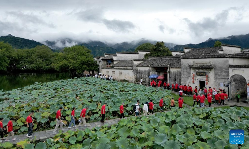 This aerial photo taken on Sept. 13, 2023 shows people visiting the Hongcun village in Yixian County of Huangshan City, east China's Anhui Province.(Photo: Xinhua)