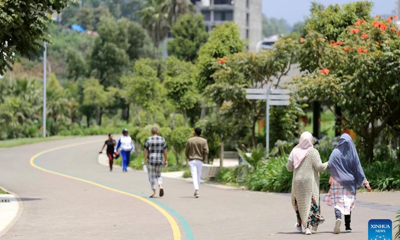 This photo taken on Sept. 16, 2023 shows pedestrians in the Friendship Square in Addis Ababa, Ethiopia. As an integral part of the Ethiopian government's city beautification agenda, the China-aided Addis Ababa riverside green development project is expected to greatly improve the surrounding living environment of Addis Ababa, the capital of Ethiopia, with important social, tourism and commercial value. (Xinhua/Wang Ping)