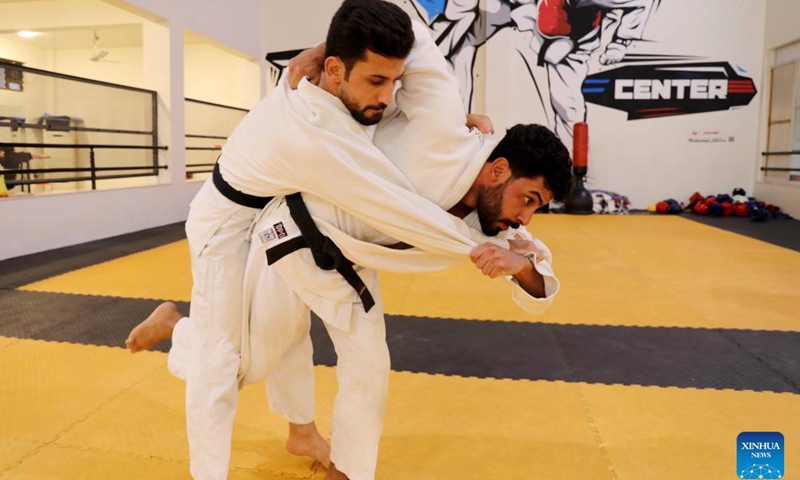 Athletes of the Iraqi judo team train in preparation for Hangzhou Asian Games at the Baghdad Sports Center in Baghdad, Iraq, Sept. 14, 2023. (Xinhua/Khalil Dawood)

