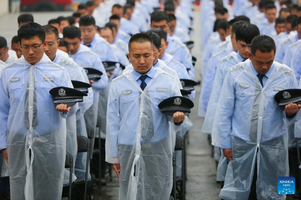 People pay a silent tribute in front of the Exhibition Hall of Evidence of Crime Committed by Unit 731 of the Japanese Imperial Army in Harbin, northeast China's Heilongjiang Province, Sept. 18, 2023. Various activities were held on Sept. 18 to commemorate the 92nd anniversary of the September 18 Incident in Harbin of northeast China's Heilongjiang Province(Photo: Xinhua)