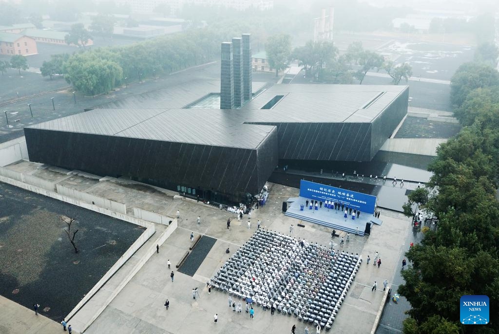 This aerial photo taken on Sept. 18, 2023 shows people participating in an event to commemorate the 92nd anniversary of the September 18 Incident at the square of the Exhibition Hall of Evidence of Crime Committed by Unit 731 of the Japanese Imperial Army in Harbin, northeast China's Heilongjiang Province. Various activities were held on Sept. 18 to commemorate the 92nd anniversary of the September 18 Incident in Harbin of northeast China's Heilongjiang Province.(Photo: Xinhua)