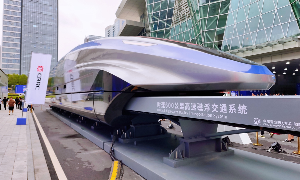 Visitors walk past a 600-kilometer-per-hour high-speed maglev transportation system at the World Manufacturing Convention in Hefei, East China's Anhui Province on September 20, 2023. The event saw cooperation deals signed on the first day, attracting investment worth 350 billion yuan ($47.97 billion). Photo: VCG