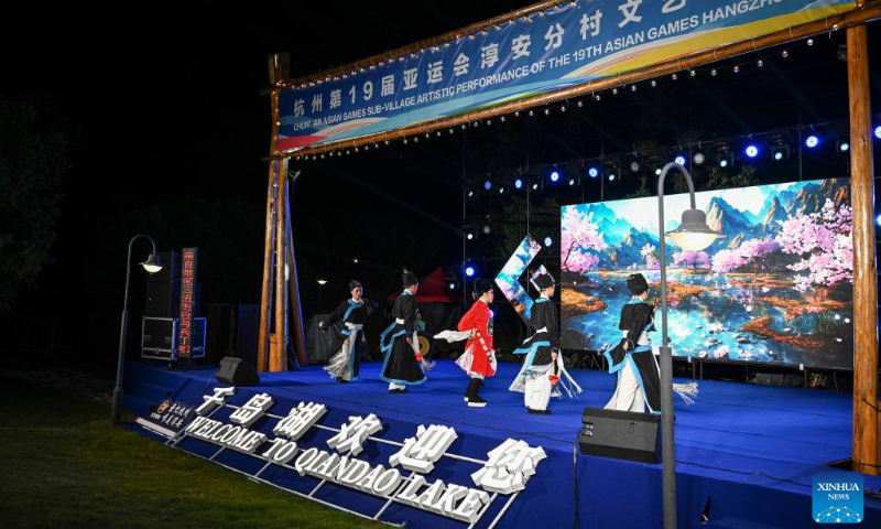 A show is staged during an artistic performance promoting Chinese culture at the Asian Games Sub-village in Chun'an, east China's Zhejiang Province, Sept. 25, 2023. (Xinhua/Hu Huhu)