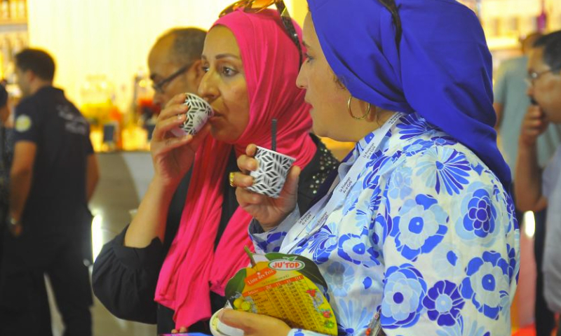 A woman tastes coffee at the international coffee exhibition Spring of Coffee in Tunis, Tunisia, on Oct. 5, 2023. (Photo by Adel Ezzine/Xinhua)