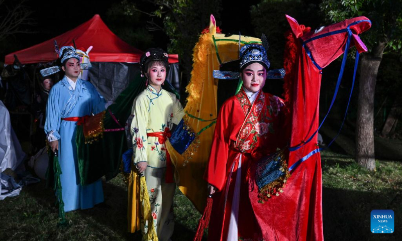 Performers prepare to go on stage during an artistic performance promoting Chinese culture at the Asian Games Sub-village in Chun'an, east China's Zhejiang Province, Sept. 25, 2023. (Xinhua/Hu Huhu)