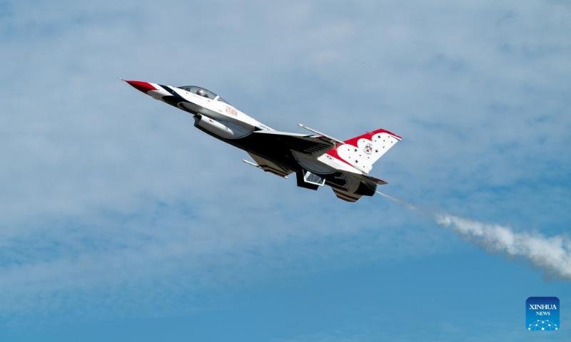 An F-16 Fighting Falcon aircraft from the U.S. Air Force Thunderbirds performs during the airshow at Ellington Airport, Houston, Texas, the United States, on Oct. 14, 2023. The annual Wings Over Houston Airshow is held from Oct. 14 to 15. (Photo by Chen Chen/Xinhua)