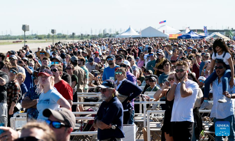 People watch the performance of the U.S. Air Force Thunderbirds during the airshow at Ellington Airport, Houston, Texas, the United States, on Oct. 14, 2023. The annual Wings Over Houston Airshow is held from Oct. 14 to 15. (Photo by Chen Chen/Xinhua)