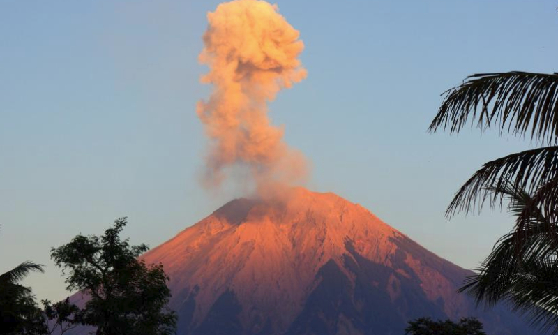 This photo taken on Oct. 1, 2023 shows volcanic materials spewing from Mount Semeru, as seen from Lumajang, East Java, Indonesia. (Photo by Dwi Sasongko/Xinhua)