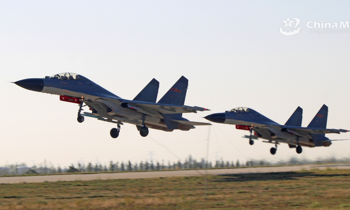 Two J-11 fighter jets attached to an aviation brigade with the air force under the PLA Western Theater Command take off in formation during a flight training exercise on September 21, 2023. Photo:China Military