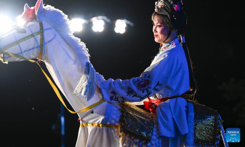 An actress performs during an artistic performance promoting Chinese culture at the Asian Games Sub-village in Chun'an, east China's Zhejiang Province, Sept. 25, 2023. (Xinhua/Hu Huhu)