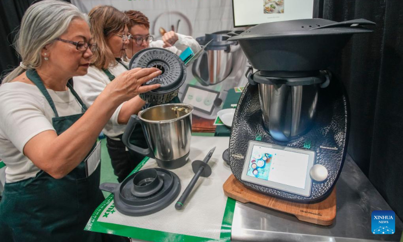 A multipurpose cooker is displayed during the Vancouver Fall Home Show at the Vancouver Convention Centre in Vancouver, British Columbia, Canada, on Sept. 28, 2023. The Vancouver Fall Home Show returned for its 41st year with about 200 exhibitors showcasing their latest products and services. The show kicked off here on Sept. 28 and would last until Oct. 1. (Photo by Liang Sen/Xinhua)