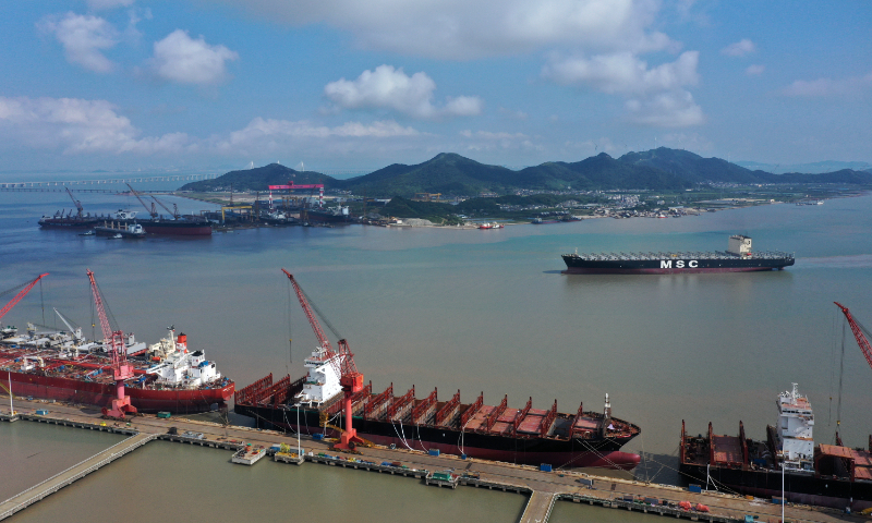 A containership, the <em>MSC ASYA</em>, returns from a trial voyage after a desulfurization refit and routine repairs at a berth in Zhoushan, East China's Zhejiang Province, on September 26, 2023. In the first half of 2023, the output of Zhoushan's shipbuilding industry increased by 47.2 percent year-on-year, with orders in hand at a five-year high. Photo: cnsphoto