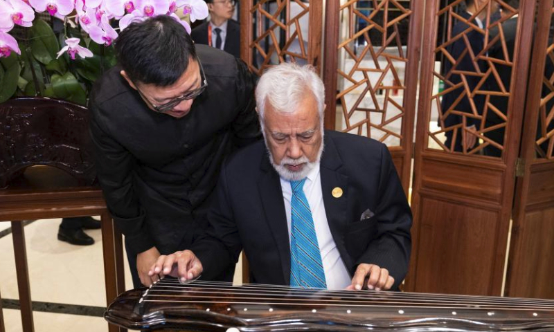 Prime Minister Xanana Gusmao of Timor-Leste participates in an activity demonstrating intangible cultural heritages before a welcoming banquet in Hangzhou, capital city of east China's Zhejiang Province, Sept. 23, 2023. (Xinhua/Huang Jingwen)