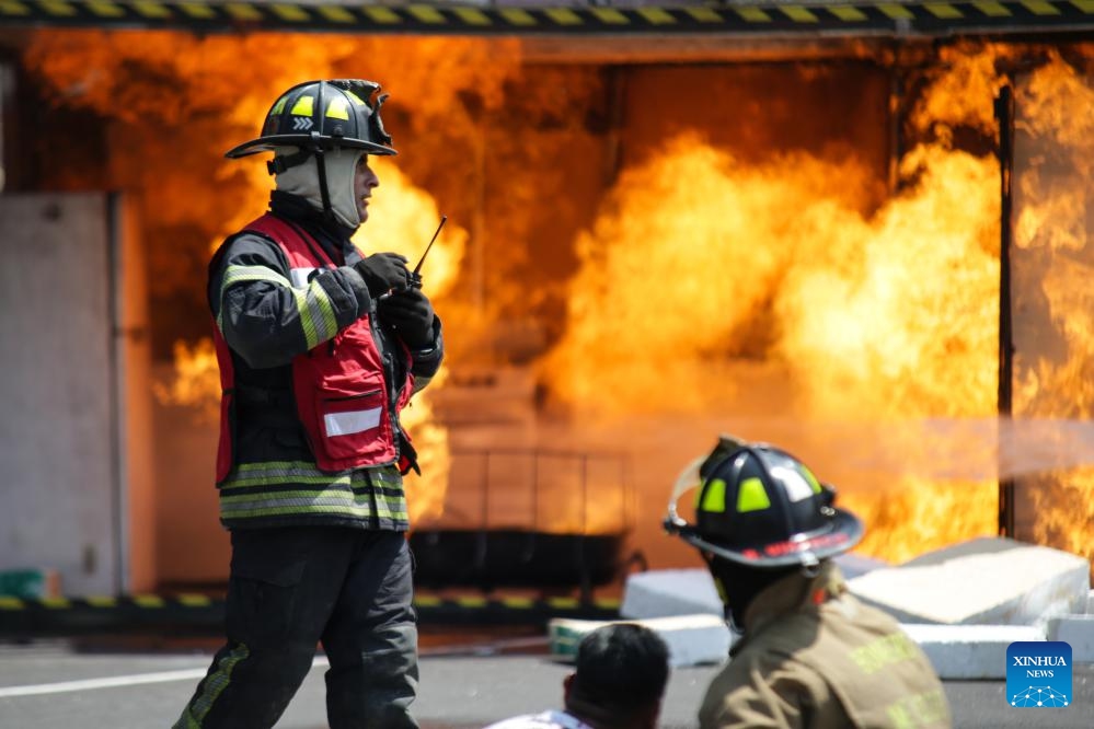 Firefighters take part in the Second National Drill 2023, in Mexico City, capital of Mexico, on Sept. 19, 2023.(Photo: Xinhua)