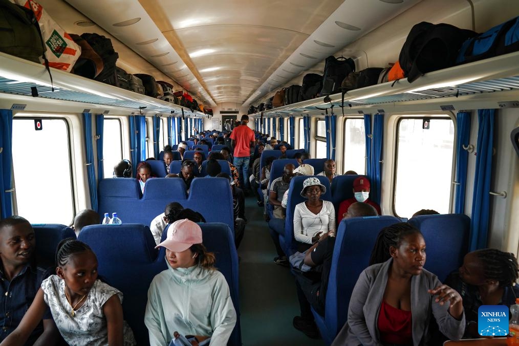 Passengers are seen in the train to Mombasa at Nairobi Terminus Station of the China built Mombasa-Nairobi Standard Gauge Railway (SGR) in Nairobi, Kenya, Sept. 20, 2023. In 2017, the SGR, built and operated by China Road and Bridge Corporation, was officially opened to traffic. As the first railway built since Kenya's independence, it runs 480 km between the capital Nairobi and the port city of Mombasa.(Photo: Xinhua)