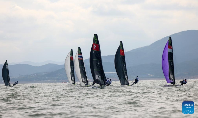 Sailors compete during the Men's Skiff 49er Race of sailing at the 19th Asian Games in Ningbo, east China's Zhejiang Province, Sept. 24, 2023. (Xinhua/Zhang Tao)