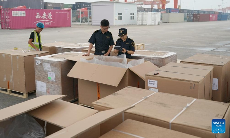 Customs officers check imported products at Xi'an International Port in Xi'an, northwest China's Shaanxi Province, Sept. 11, 2023. The Chang'an China-Europe freight train service was launched in 2013, when China proposed the Belt and Road Initiative.

In the past ten years, Xi'an International Port, the starting station of the Chang'an China-Europe freight trains, has been developed from a small cargo station to an international logistic hub. (Xinhua/Shao Rui)