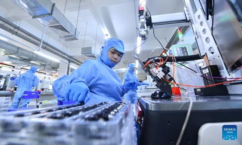 Employees work on a production line of Liuzhou Yuanchuang EFI Thecnology Co., Ltd. in Liuzhou City, south China's Guangxi Zhuang Autonomous Region, Sept. 21, 2023. In recent years, Liuzhou has been promoting the cultivation and expansion of emerging industries such as new-energy, intelligent equipment and smart home appliances manufacturing, biomedicine and new-generation information technology. (Xinhua/Huang Xiaobang)