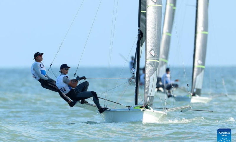 Liu Tian/Wen Zaiding of China compete during the Men's Skiff 49er Race of sailing at the 19th Asian Games in Ningbo, east China's Zhejiang Province, Sept. 24, 2023. (Xinhua/Zhang Tao)