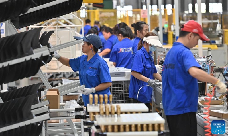 Employees work on a production line of an electrical equipment company in Liuzhou City, south China's Guangxi Zhuang Autonomous Region, Sept. 21, 2023. In recent years, Liuzhou has been promoting the cultivation and expansion of emerging industries such as new-energy, intelligent equipment and smart home appliances manufacturing, biomedicine and new-generation information technology. (Xinhua/Huang Xiaobang)