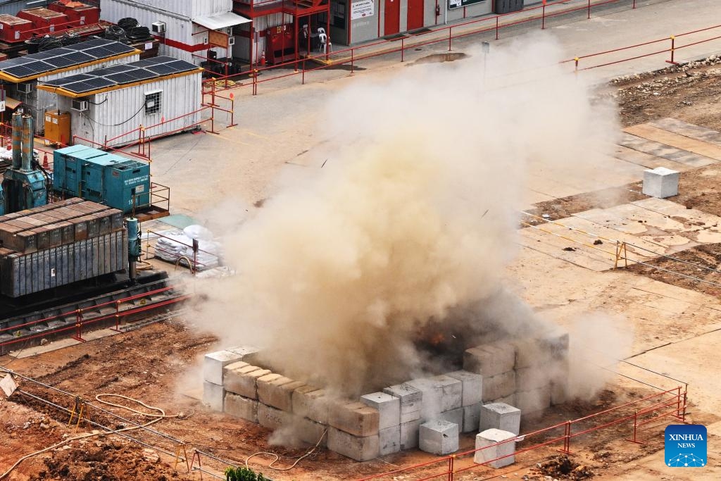 Smoke rises as a 100-kilogram World War II bomb is detonated by members of the Singapore Armed Forces (SAF) at a construction site in Singapore, Sept. 26, 2023. Singapore's military on Tuesday detonated an unexploded World War II bomb after evacuating over 4,000 residents nearby.(Photo: Xinhua)