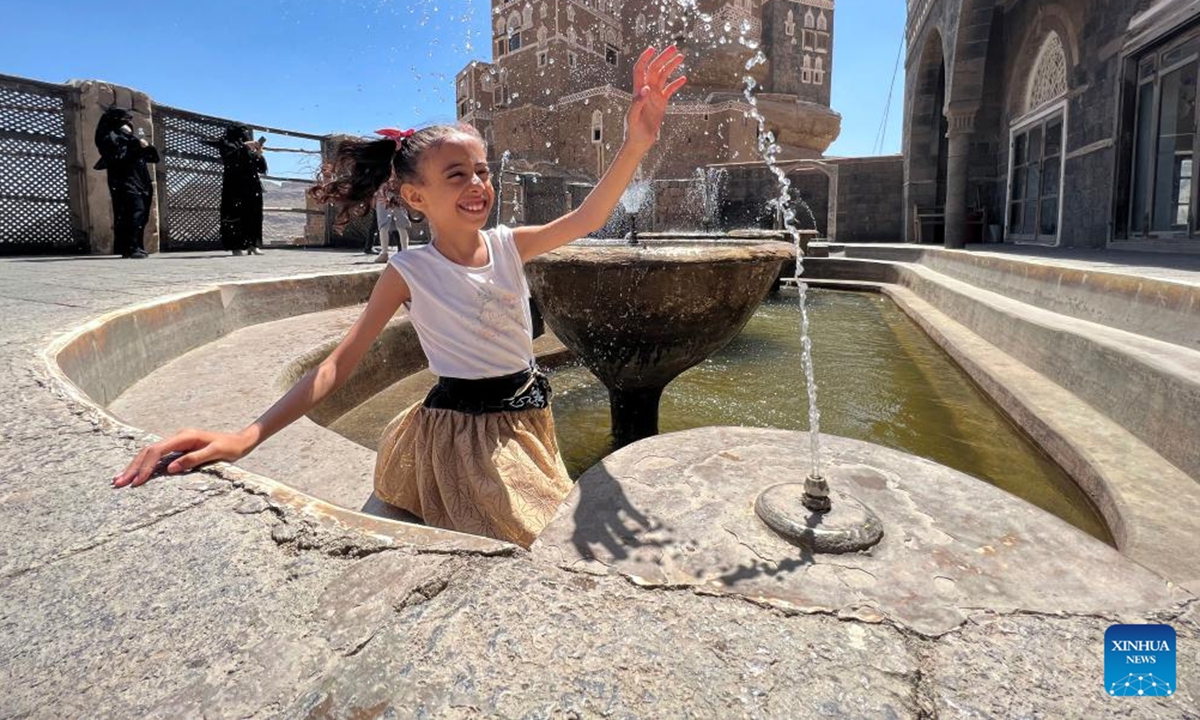 A girl enjoys the water sprayed from a fountain at the Dar al-Hajar (Rock Palace), north of Sanaa, Yemen, Sept. 29, 2023. (Photo by Mohammed Mohammed/Xinhua)


