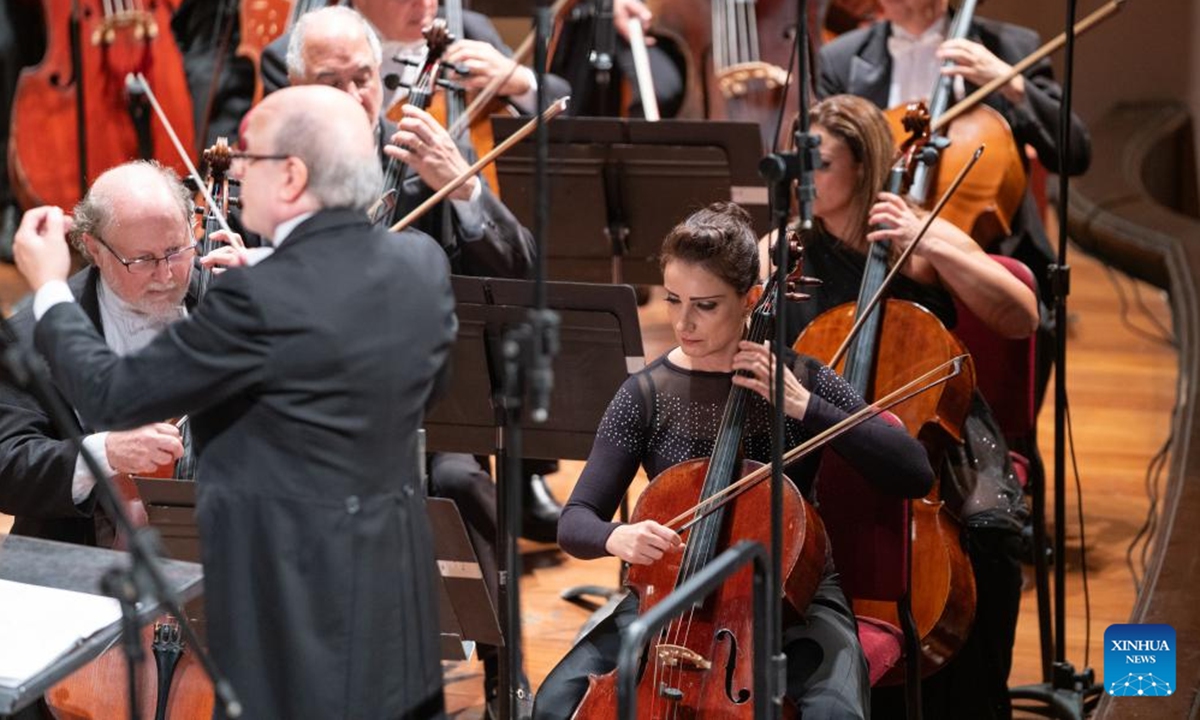 Members of Brazilian Symphony Orchestra perform at the Municipal Theatre of Rio de Janeiro in Brazil, Sept. 28, 2023. On Friday night, Du Xuan, the concertmaster of Symphony Orchestra of China National Opera House, played The Butterfly Lovers with Brazilian Symphony Orchestra, showcasing the charm of Chinese culture and art. (Xinhua/Wang Tiancong)

