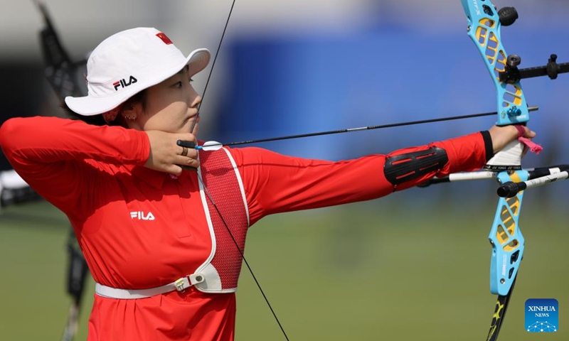 Hailigan of China competes during the Recurve Mixed Team 1/8 Elimination of Archery between team China and team China's Hong Kong at the 19th Asian Games in Hangzhou, east China's Zhejiang Province, Oct. 2, 2023. (Xinhua/Meng Chenguang)