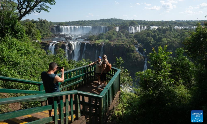 Tourists pose for photos at Iguazu National Park in the state of Parana, Brazil, Oct. 1, 2023. (Xinhua/Wang Tiancong)