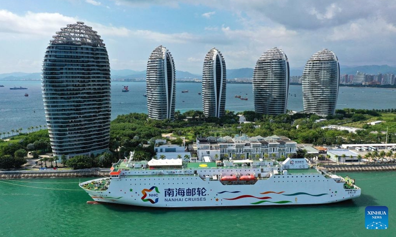 This aerial photo taken on Oct. 1, 2023 shows a cruise ship harboring at a port in Sanya, south China's Hainan Province. As a popular tourist destination, Sanya is seeing a tourism boom during the National Day holiday. (Xinhua/Guo Cheng)