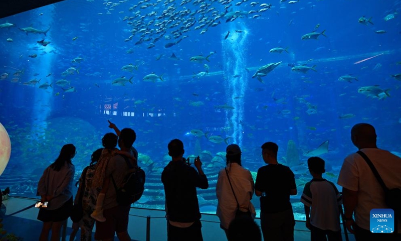 Tourists visit an aquarium in Sanya, south China's Hainan Province, Sept. 30, 2023. As a popular tourist destination, Sanya is seeing a tourism boom during the National Day holiday. (Xinhua/Guo Cheng)