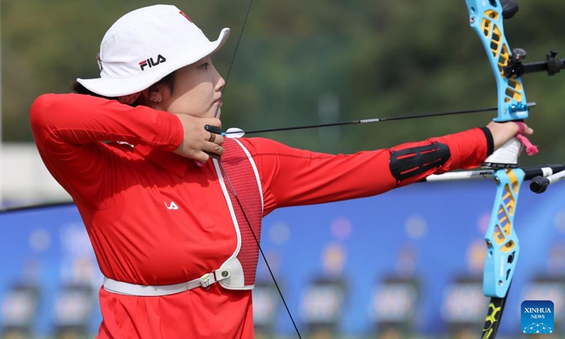 Hailigan of China competes during the Recurve Mixed Team 1/8 Elimination of Archery between team China and team China's Hong Kong at the 19th Asian Games in Hangzhou, east China's Zhejiang Province, Oct. 2, 2023. (Xinhua/Meng Chenguang)