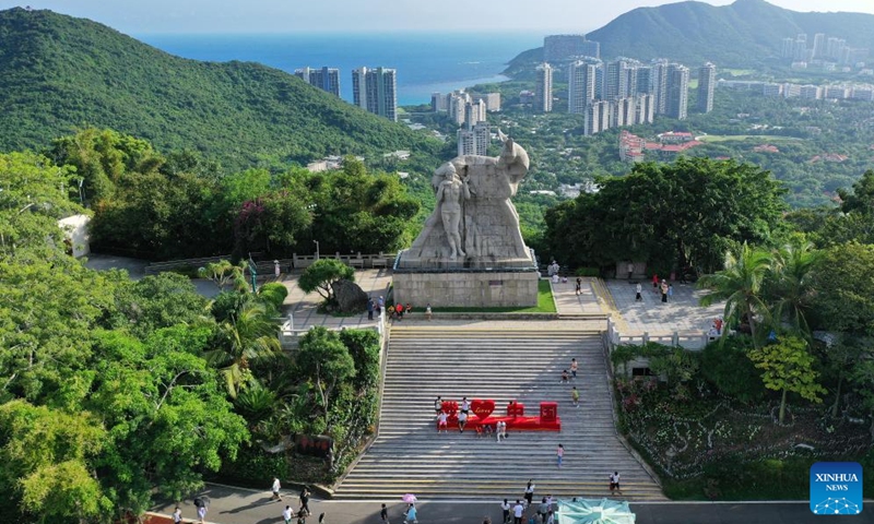 This aerial photo taken on Oct. 1, 2023 shows tourists visiting a scenic spot in Sanya, south China's Hainan Province. As a popular tourist destination, Sanya is seeing a tourism boom during the National Day holiday. (Xinhua/Guo Cheng)