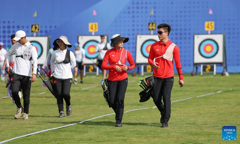 Wei Shaoxuan (1st R)/Hailigan (2nd R) of China and Kwok Yin Chai (1st L)/Poon Wei Tsing Natalie of China's Hong Kong compete during the Recurve Mixed Team 1/8 Elimination of Archery between team China and team China's Hong Kong at the 19th Asian Games in Hangzhou, east China's Zhejiang Province, Oct. 2, 2023. (Xinhua/Meng Chenguang)