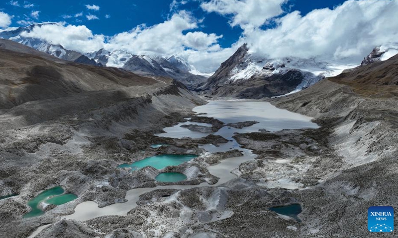 This aerial photo taken on Sept. 29, 2023 shows a proglacial lake in the Mount Cho Oyu region. An 18-member expedition team successfully reached on Sunday the summit of Mount Cho Oyu, also known as Mt. Qowowuyag, which soars to 8,201 meters above sea level, to carry out scientific research. It was the first time Chinese scientists scaled a peak exceeding 8,000 meters in altitude apart from Mt. Qomolangma, the world's highest summit. Photo: Xinhua