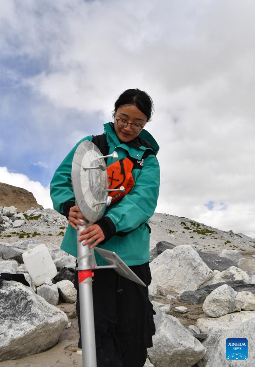 A member of a Chinese expedition team sets up a portable weather station in the Mount Cho Oyu region on Oct. 1, 2023. An 18-member expedition team successfully reached on Sunday the summit of Mount Cho Oyu, also known as Mt. Qowowuyag, which soars to 8,201 meters above sea level, to carry out scientific research. It was the first time Chinese scientists scaled a peak exceeding 8,000 meters in altitude apart from Mt. Qomolangma, the world's highest summit. Photo: Xinhua