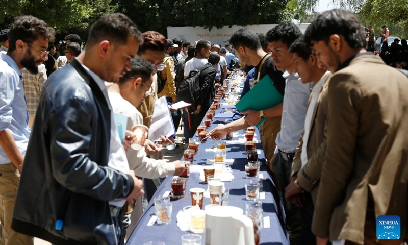 Visitors try out coffee at a coffee festival in Sanaa, Yemen, on Oct. 2, 2023. Yemen has a long history of coffee cultivation and consumption, and the beans here have a unique aroma due to the arid climate and abundant sunlight here. (Photo by Mohammed Mohammed/Xinhua)