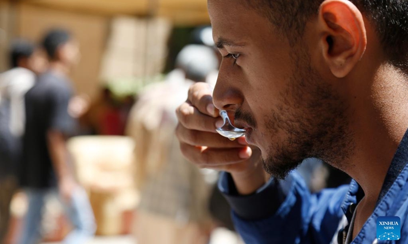 A visitor takes a sip of coffee at a coffee festival in Sanaa, Yemen, on Oct. 2, 2023. Yemen has a long history of coffee cultivation and consumption, and the beans here have a unique aroma due to the arid climate and abundant sunlight here. (Photo by Mohammed Mohammed/Xinhua)