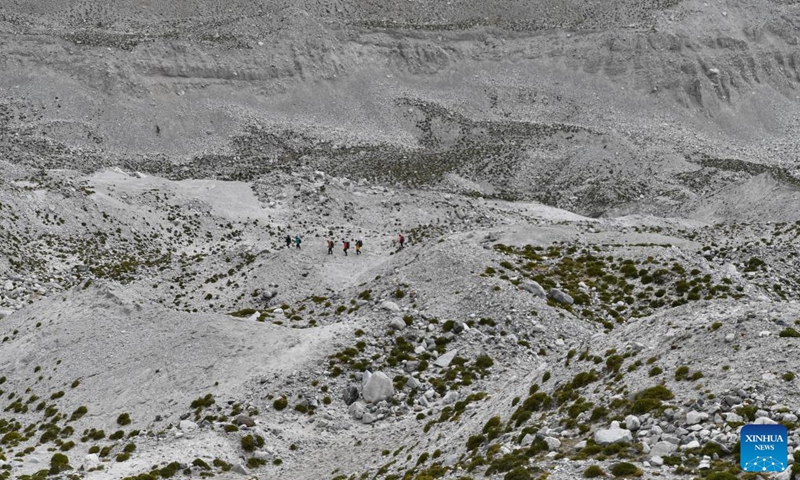 Members of a Chinese expedition team head for a proglacial lake in the Mount Cho Oyu region on Oct. 1, 2023. An 18-member expedition team successfully reached on Sunday the summit of Mount Cho Oyu, also known as Mt. Qowowuyag, which soars to 8,201 meters above sea level, to carry out scientific research. It was the first time Chinese scientists scaled a peak exceeding 8,000 meters in altitude apart from Mt. Qomolangma, the world's highest summit. Photo: Xinhua